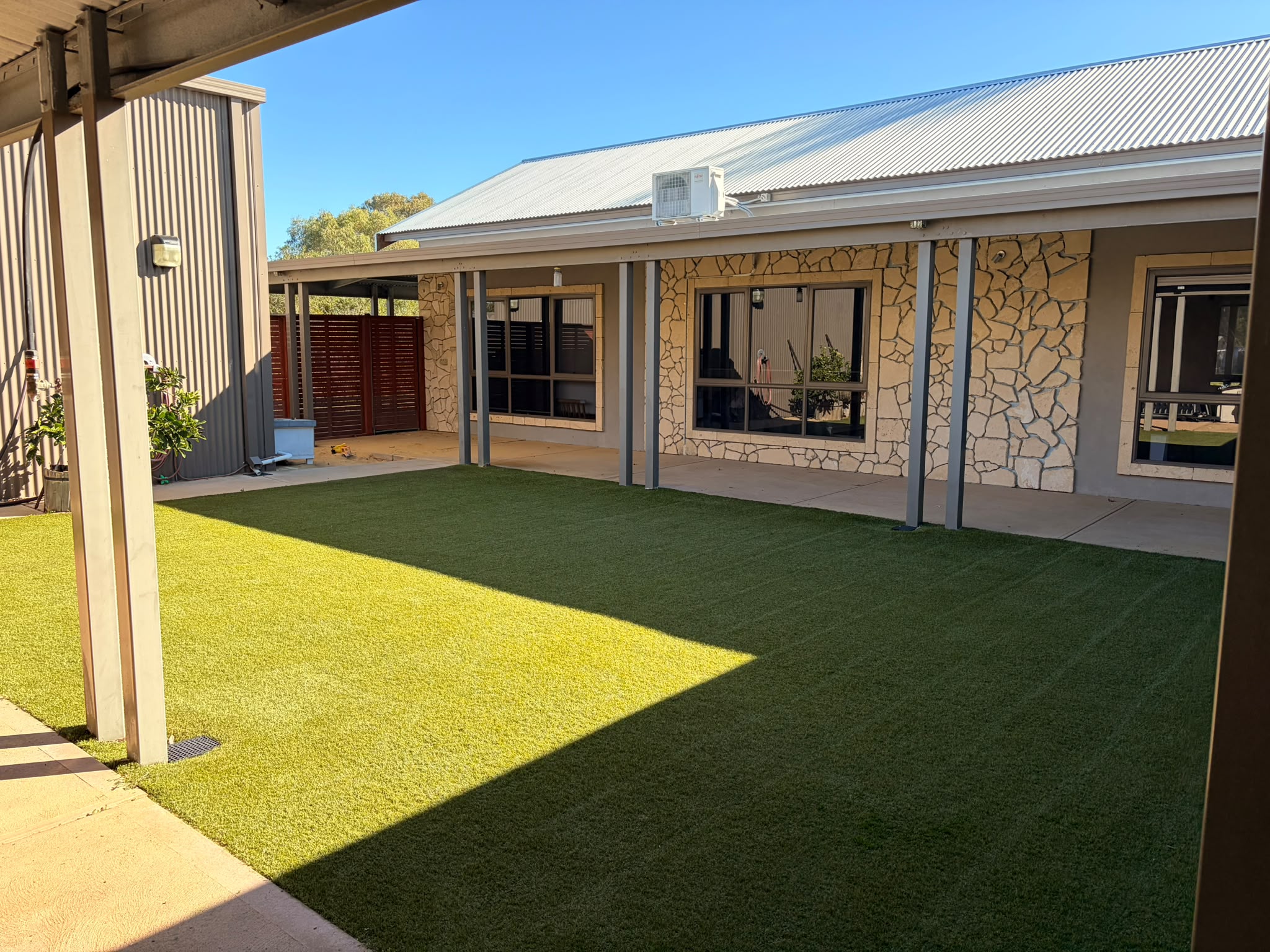 Restored artificial turf, fibres upright and green, Perth backyard