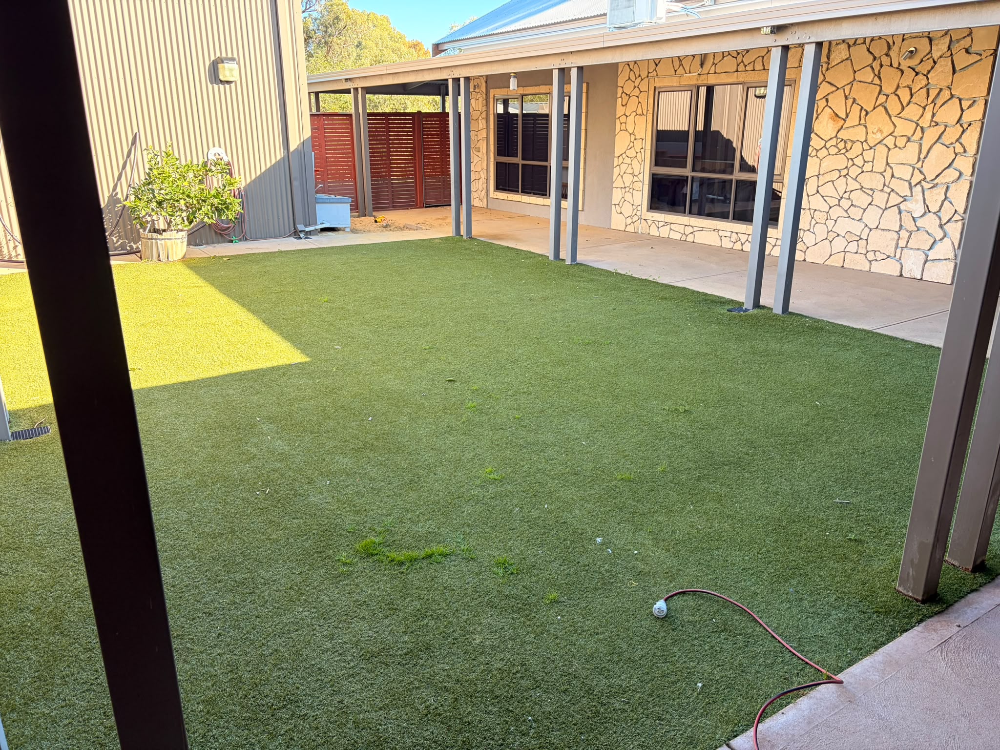 Flat, matted artificial turf before treatment