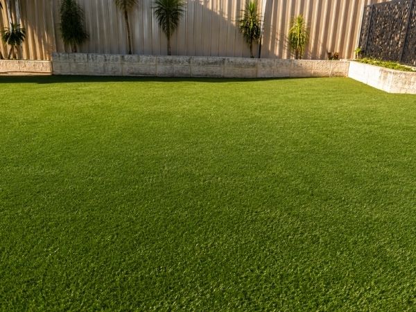 Same Baldivis backyard after the 4-stage artificial turf clean, fibres upright and vivid green